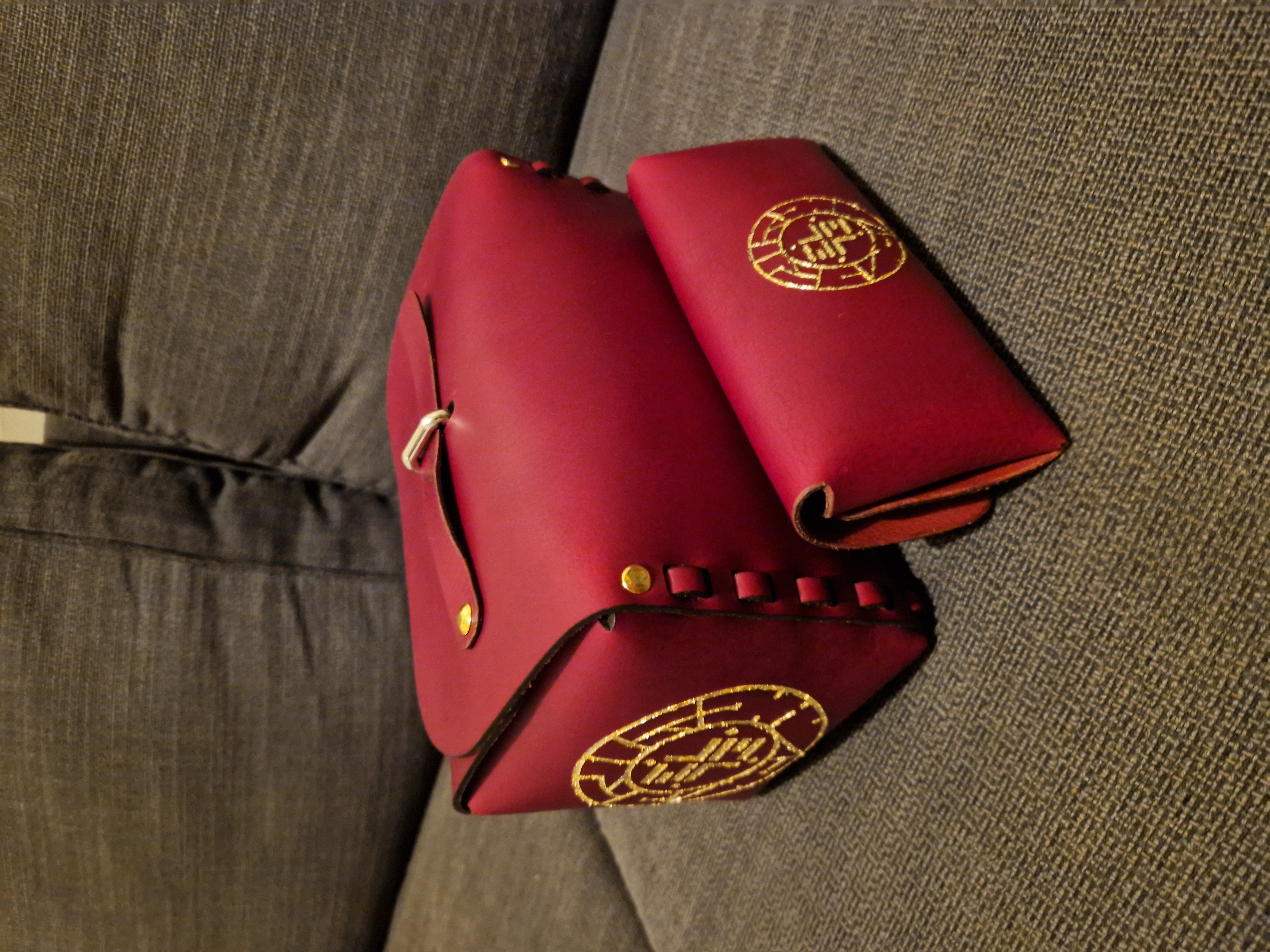 Leather accessories with custom gold logo